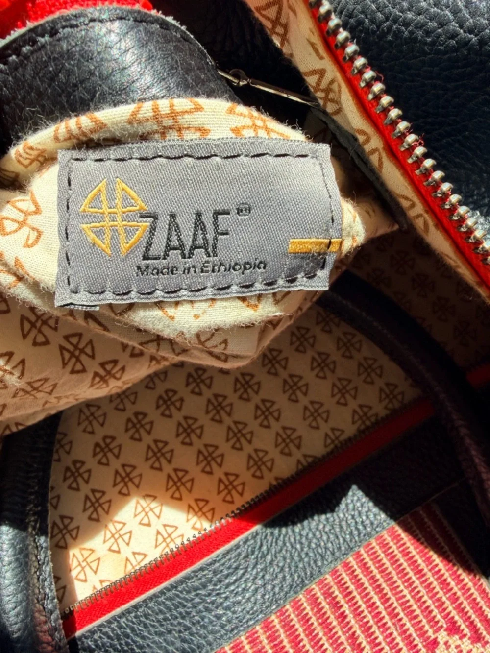 Black Leather Duffel Bag with Red Woven Center Panel